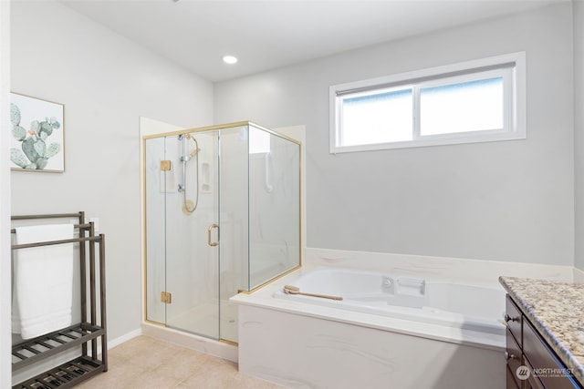 bathroom with vanity and independent shower and bath