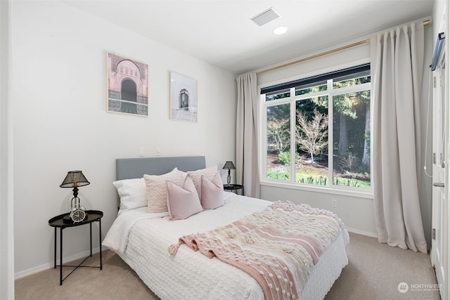 bedroom with light carpet