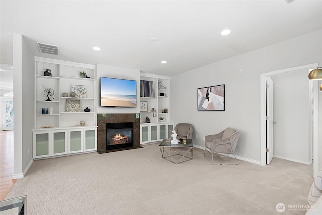 living area featuring light carpet