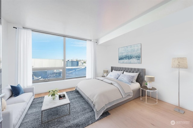 bedroom with hardwood / wood-style floors