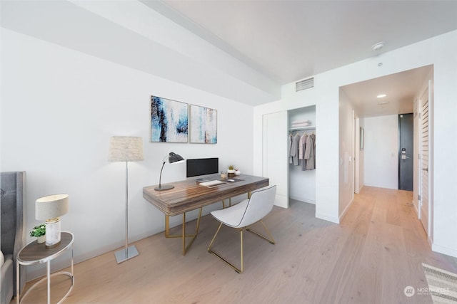 home office with light wood-type flooring