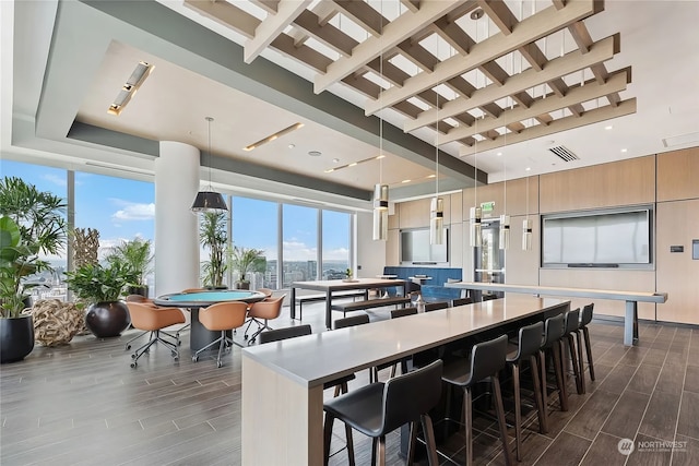 kitchen with pendant lighting, a kitchen breakfast bar, and a large island