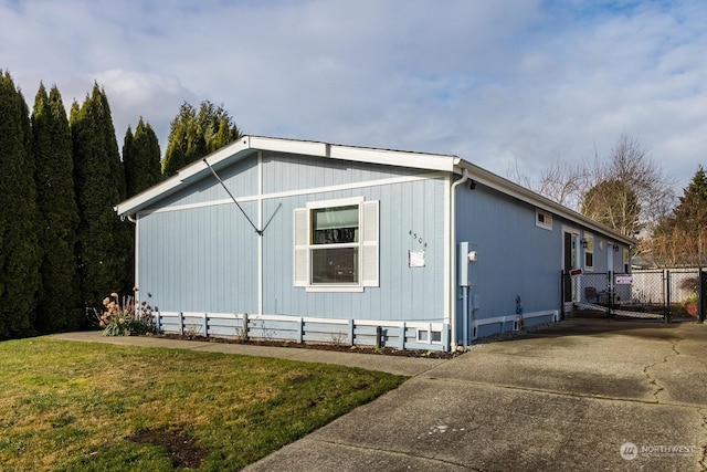 view of property exterior with a lawn