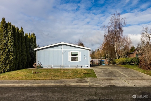 view of home's exterior with a lawn