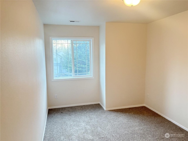 empty room with carpet flooring