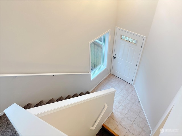 entrance foyer with light tile patterned floors