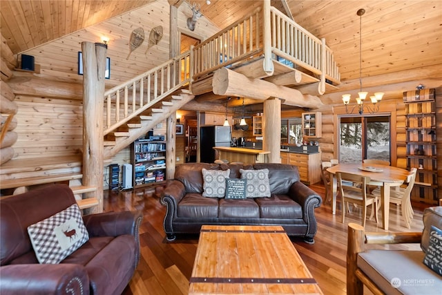 living room with wood ceiling, wood-type flooring, high vaulted ceiling, and a chandelier