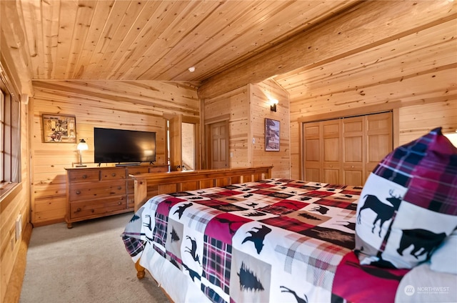 carpeted bedroom with wood ceiling, vaulted ceiling, a closet, and wood walls