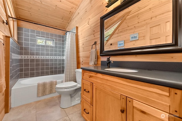 full bathroom featuring toilet, wood walls, vanity, shower / bath combo with shower curtain, and tile patterned flooring