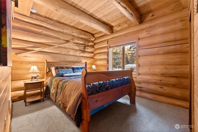 carpeted bedroom featuring beamed ceiling and wooden ceiling