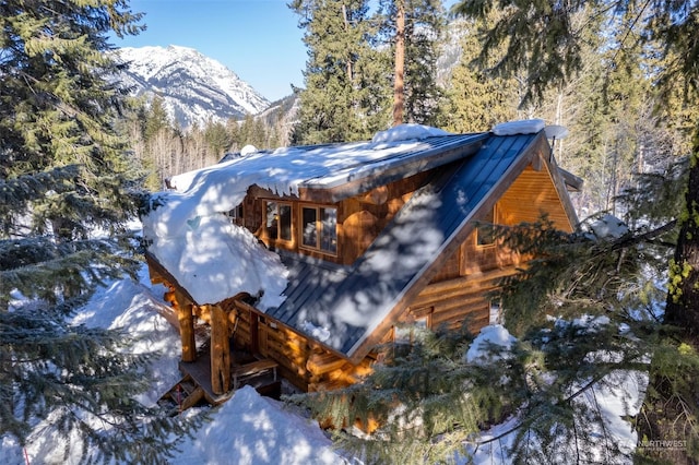 view of snowy exterior featuring a mountain view