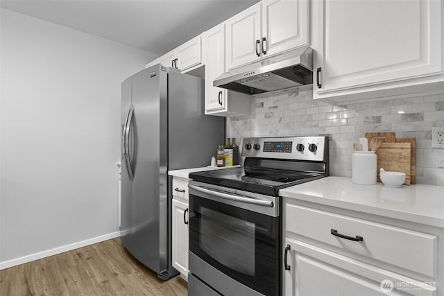 kitchen featuring backsplash, light countertops, stainless steel electric stove, and under cabinet range hood