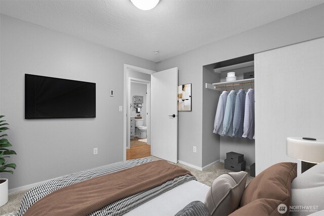 bedroom featuring baseboards and carpet floors