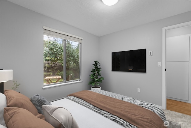 bedroom featuring wood finished floors