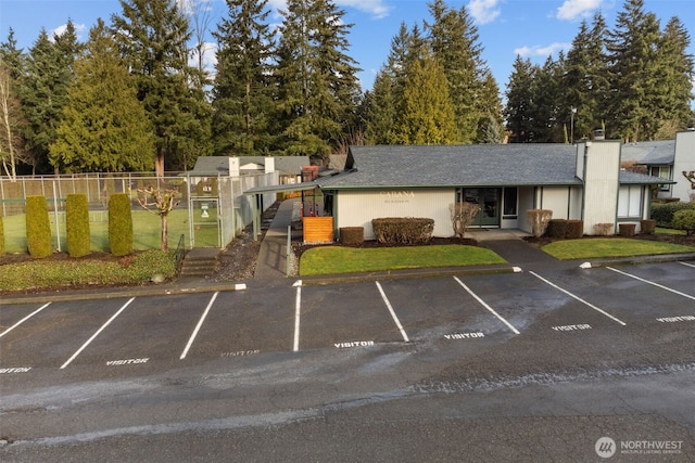 uncovered parking lot with fence