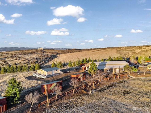 birds eye view of property with a rural view