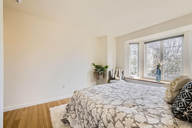 bedroom with wood-type flooring