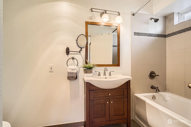 bathroom with vanity and tiled shower / bath combo