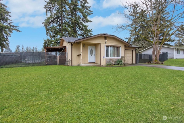 view of front of home featuring a garage and a front yard