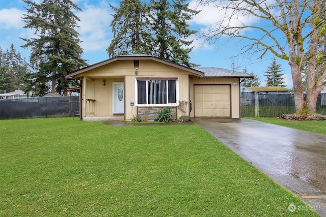 view of front of house with a garage and a front lawn