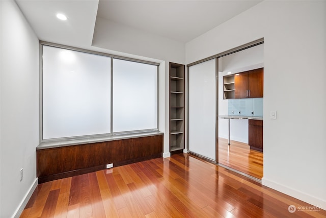 unfurnished bedroom featuring hardwood / wood-style floors