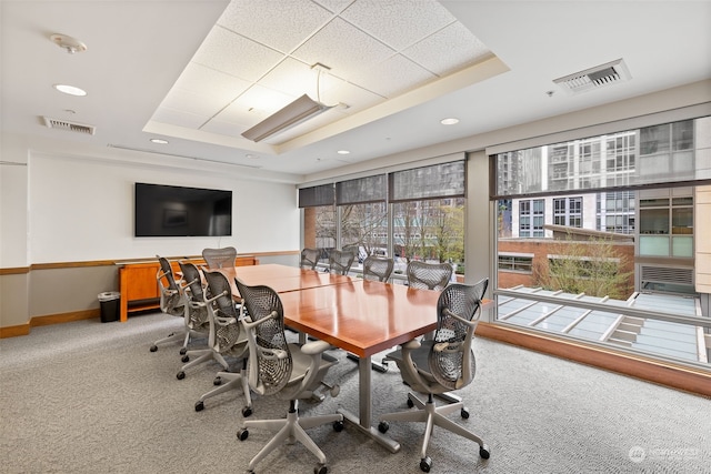 office featuring a raised ceiling and carpet