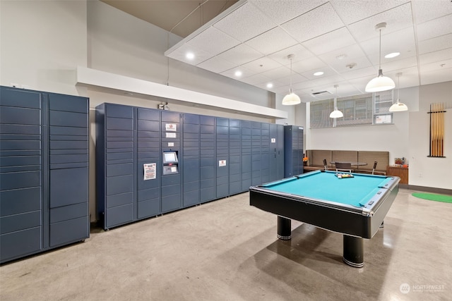 playroom with a package area, pool table, and a drop ceiling