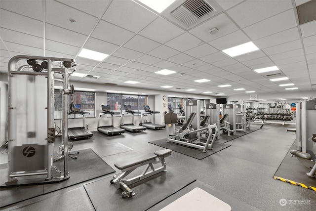 workout area featuring a drop ceiling