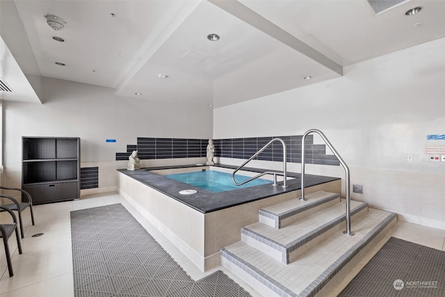 view of pool with an indoor hot tub