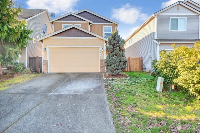 view of front facade featuring a garage and a front lawn