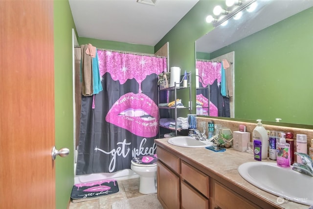 bathroom with walk in shower, vanity, and toilet