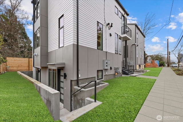 view of property exterior featuring a lawn