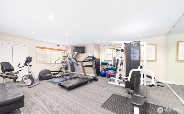 exercise room with baseboards, carpet, and recessed lighting