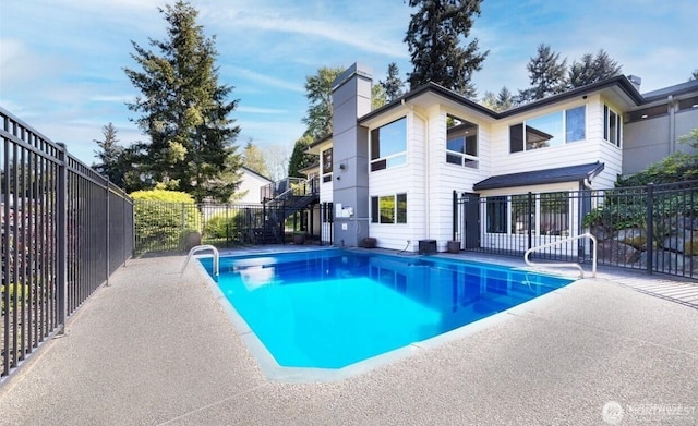 view of swimming pool with a fenced in pool, a patio area, and fence