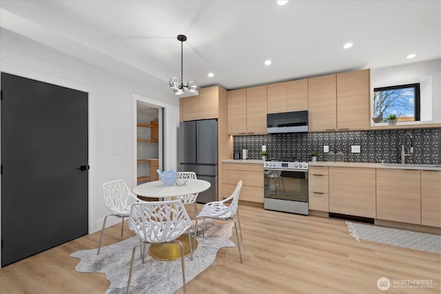 2405 E Fir St B/Adu, Unit B/Adu Seattle, WA 98122 - kitchen with sink, hanging light fixtures, stainless steel appliances, light hardwood / wood-style floors, and light brown cabinetry