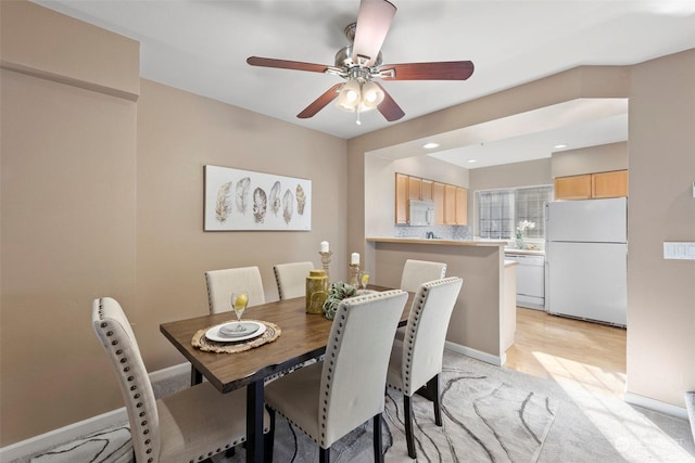 dining space with ceiling fan