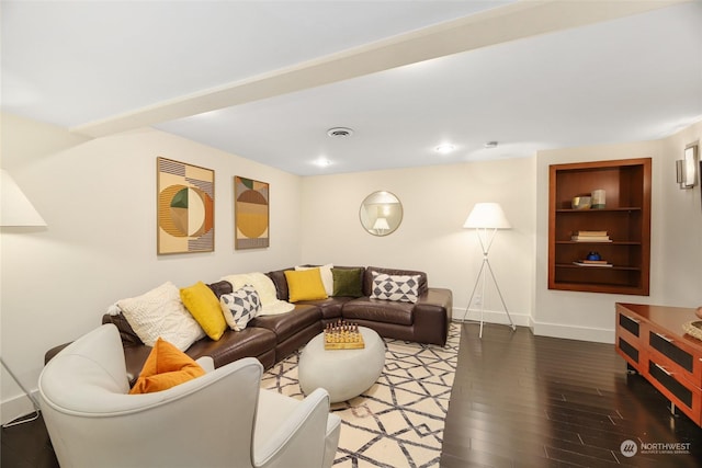 living room with hardwood / wood-style flooring and built in features