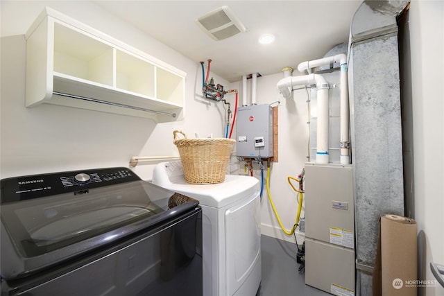 washroom with independent washer and dryer and tankless water heater