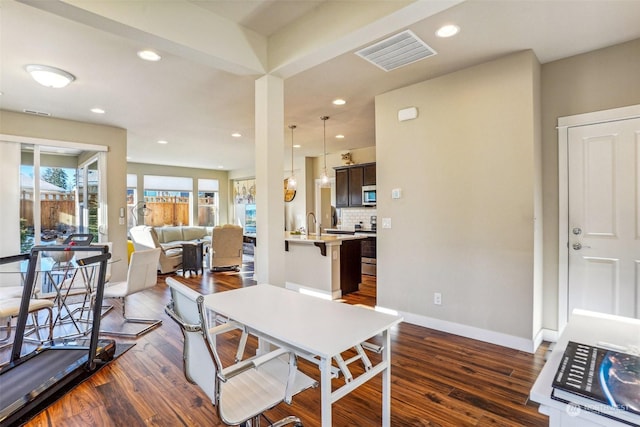 dining room featuring dark wood-type flooring