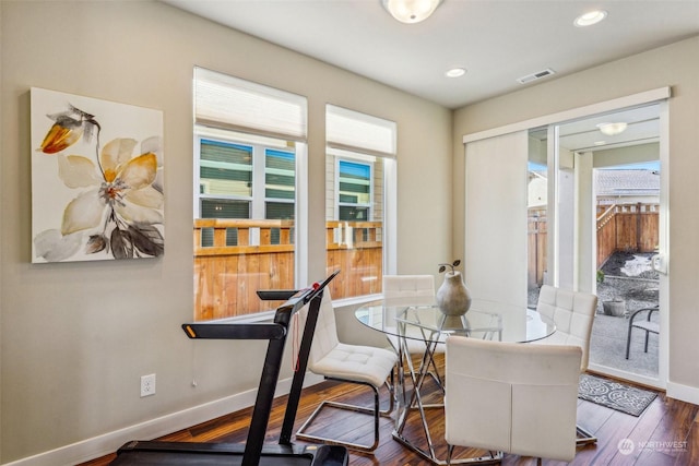 dining room with dark hardwood / wood-style flooring