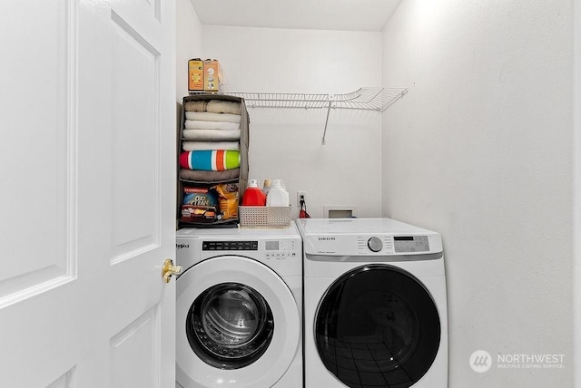 laundry area with washing machine and dryer