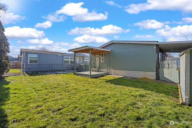 back of house featuring a lawn