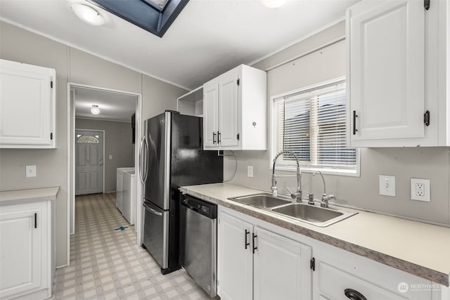 kitchen featuring white cabinetry, sink, washer and dryer, and dishwasher