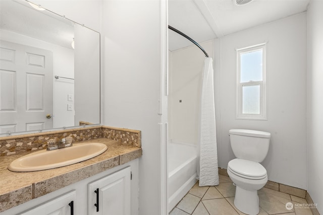 full bathroom with vanity, shower / bathtub combination with curtain, tile patterned floors, and toilet