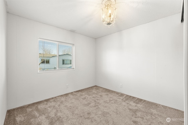 unfurnished room with light carpet