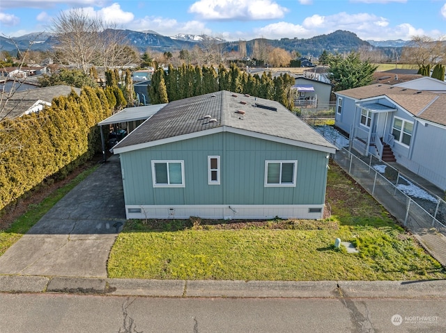 exterior space featuring a yard and a mountain view