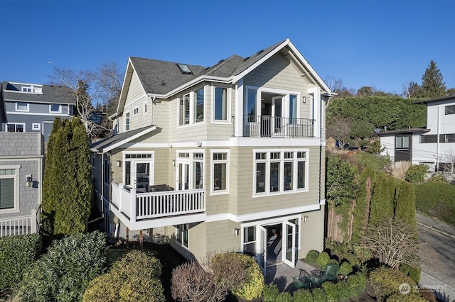 rear view of property with a balcony