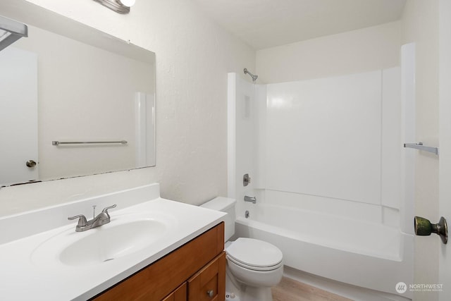 full bathroom with shower / bath combination, vanity, and toilet