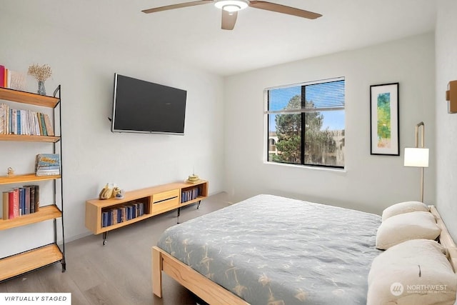 bedroom featuring ceiling fan and hardwood / wood-style floors