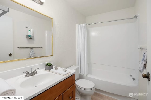 full bathroom with vanity, toilet, and shower / bath combo